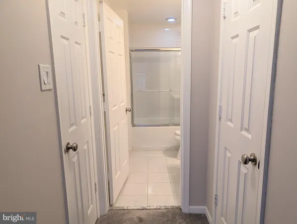 a bathroom with a glass shower door