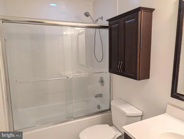 a bathroom with a shower and a toilet