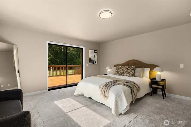 a spacious bedroom with a bed and a couch