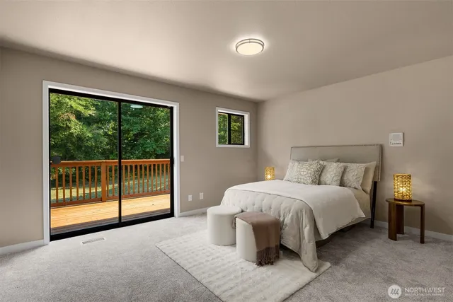 a bedroom with a bed and a night stand