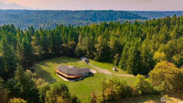 a view of a swimming pool with a yard