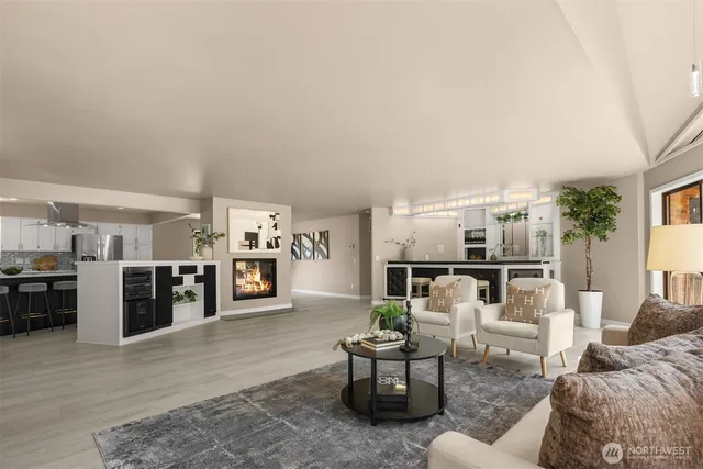 a living room with furniture and fireplace