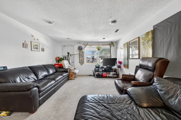 a living room with furniture and a couch