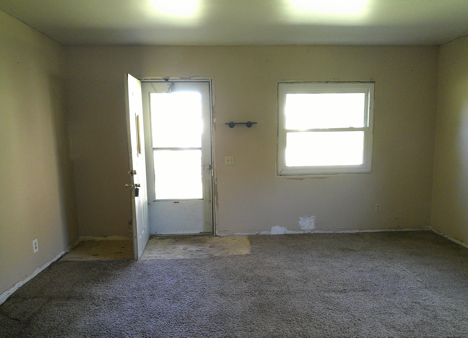 222 South Iowa Street Atwood, IL 61913 - Photo 2 of 11 an empty room with a window