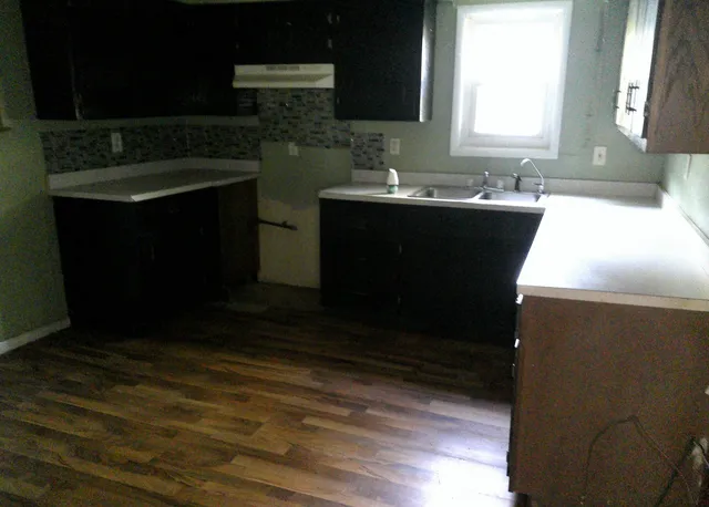 a kitchen with a sink and a microwave