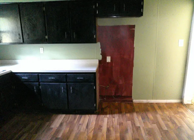 a view of hallway with wooden floor