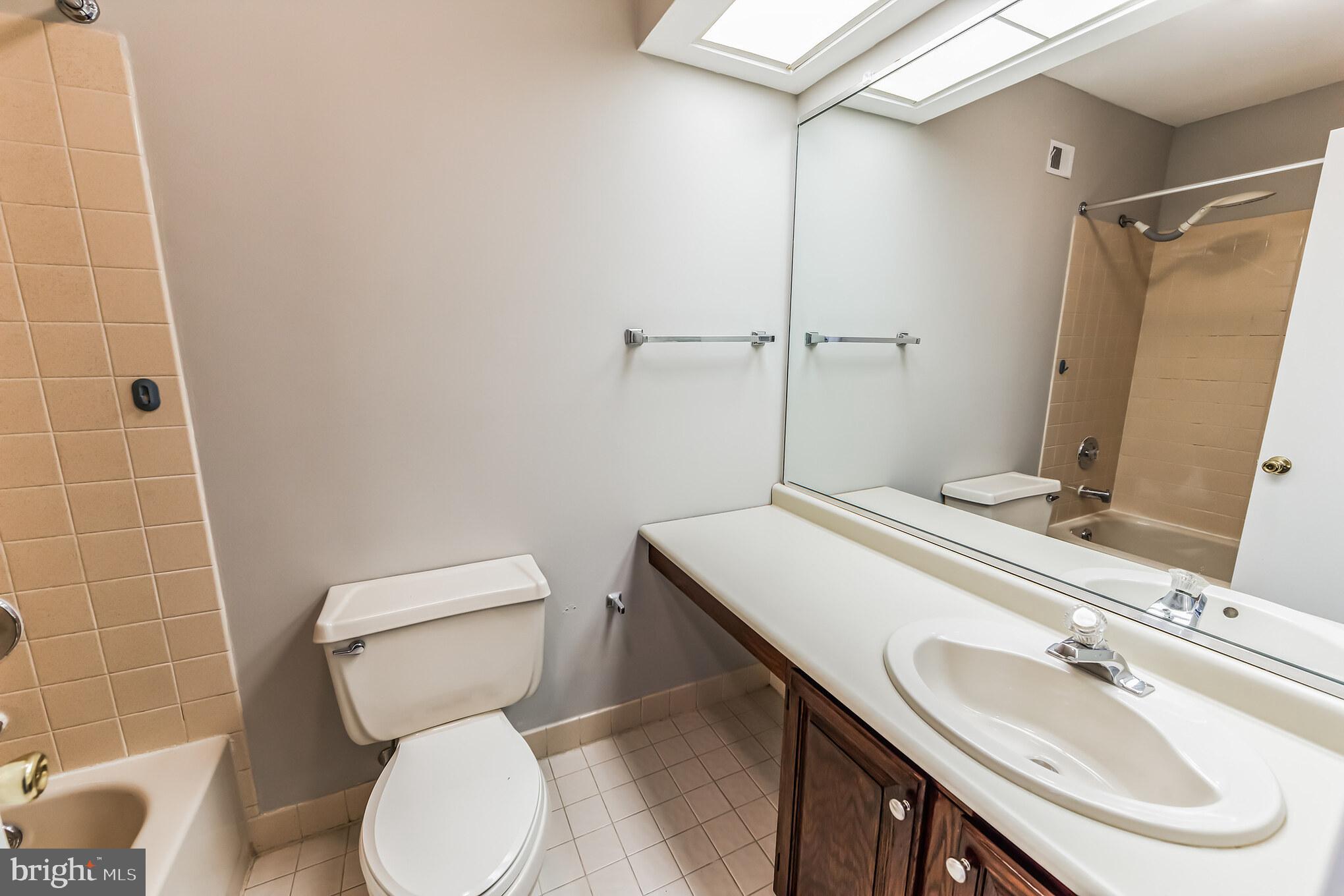 357 Saybrook Lane, Unit 158 Wallingford, PA 19086 - Photo 12 of 18 a bathroom with a sink toilet and shower