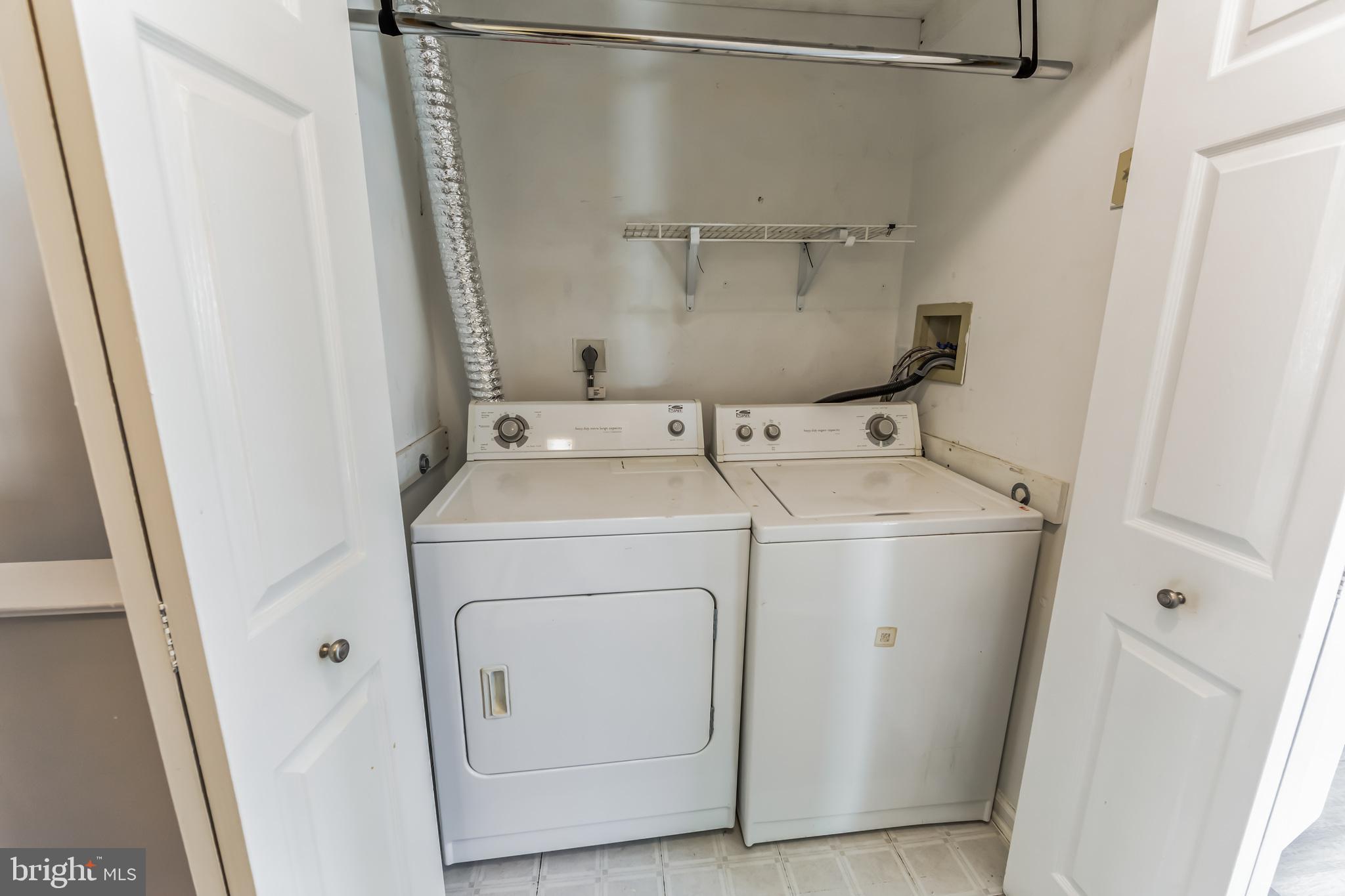 357 Saybrook Lane, Unit 158 Wallingford, PA 19086 - Photo 13 of 18 a utility room with dryer and washer