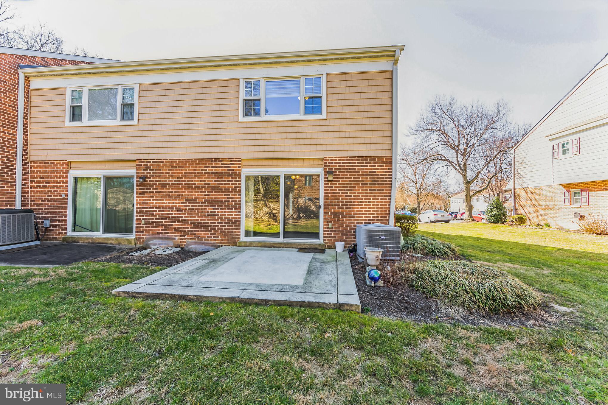 357 Saybrook Lane, Unit 158 Wallingford, PA 19086 - Photo 18 of 18 a view of a house with backyard and a tree