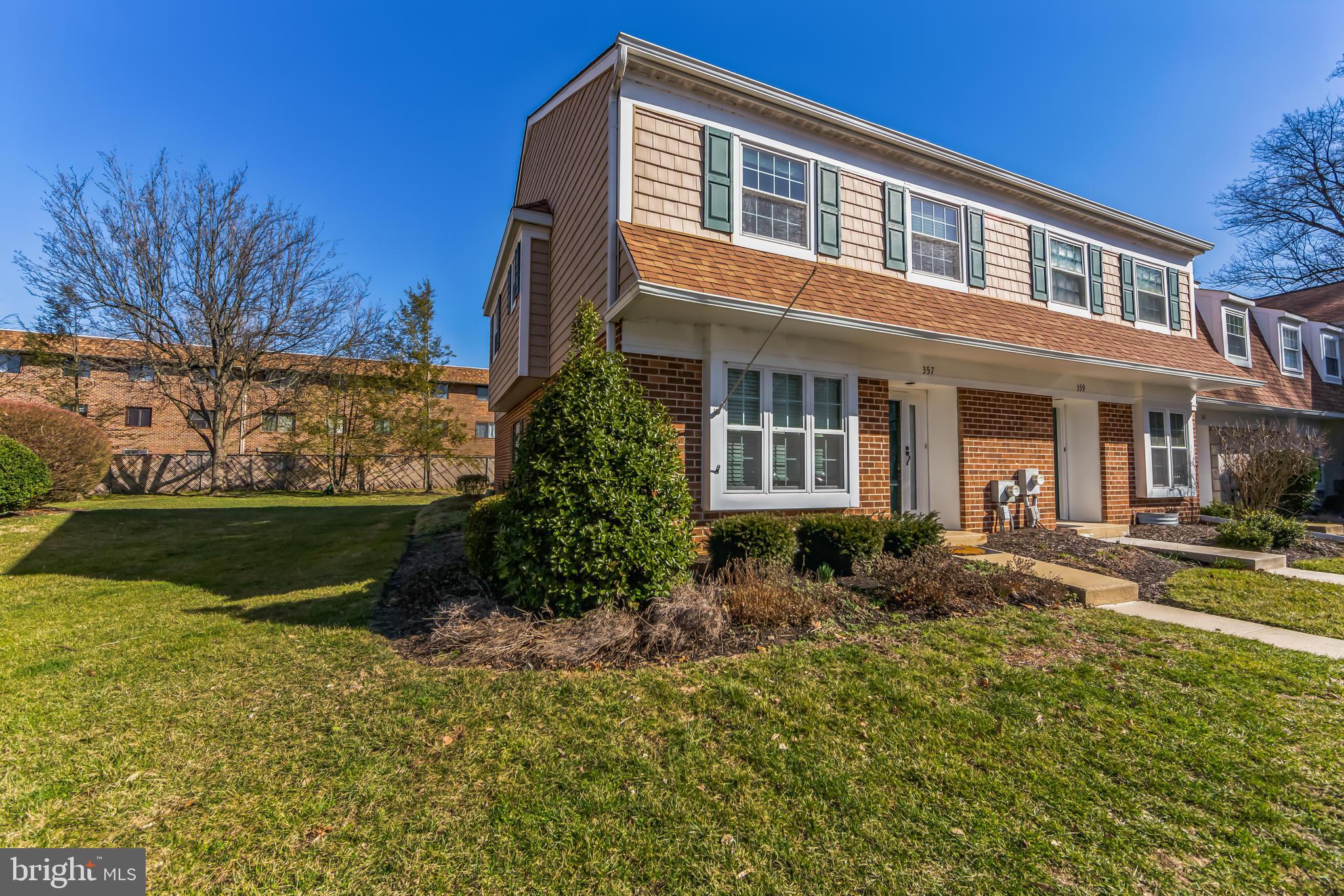 357 Saybrook Lane, Unit 158 Wallingford, PA 19086 - Photo 4 of 18 a front view of a house with a yard