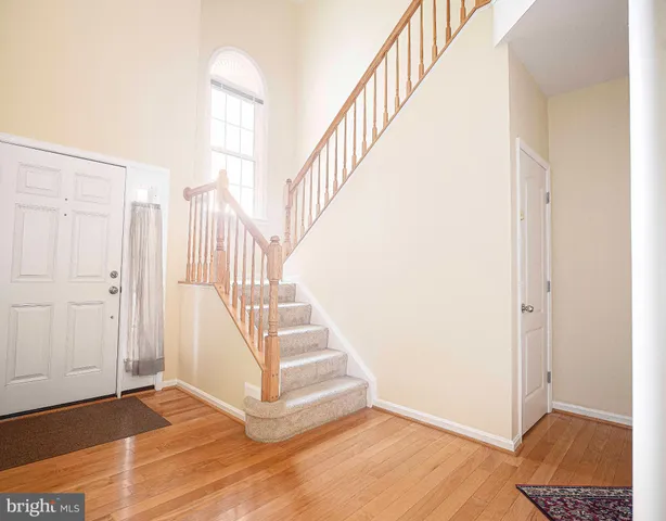 a view of entryway with wooden floor
