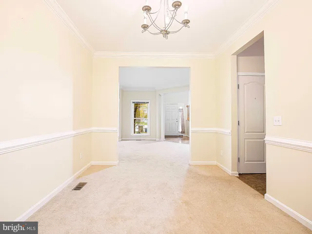 a view of a hallway with a white walls