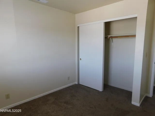 an empty room with closet