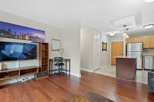 a view of a livingroom with furniture and wooden floor