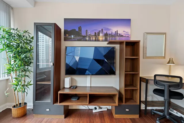 a view of living room with furniture and potted plant