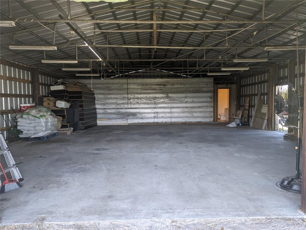 16070 Carlton Lake Road Wimauma, FL 33598 - Photo 2 of 10 a view of room with wooden ceiling