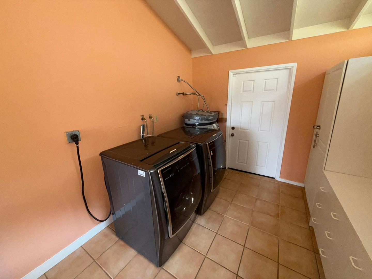 11585 McCarthy Road Carmel Valley, CA 93924 - Photo 49 of 52 a utility room with dryer and washer