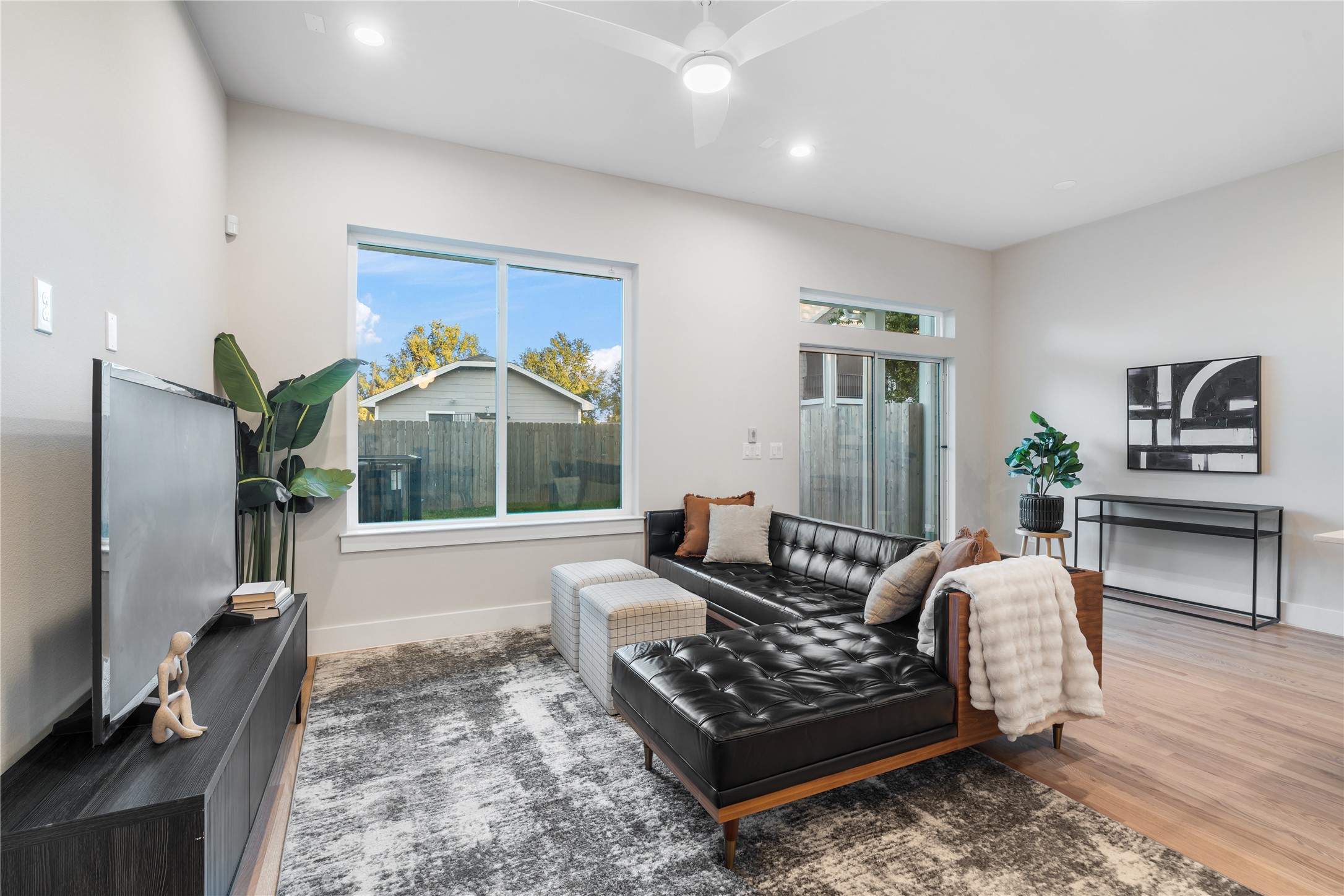 1912 Erastus Street Houston, TX 77020 - Photo 10 of 29 The expansive living room offers plenty of space for a large sectional, perfect for gathering with family or enjoying a relaxing movie night in.