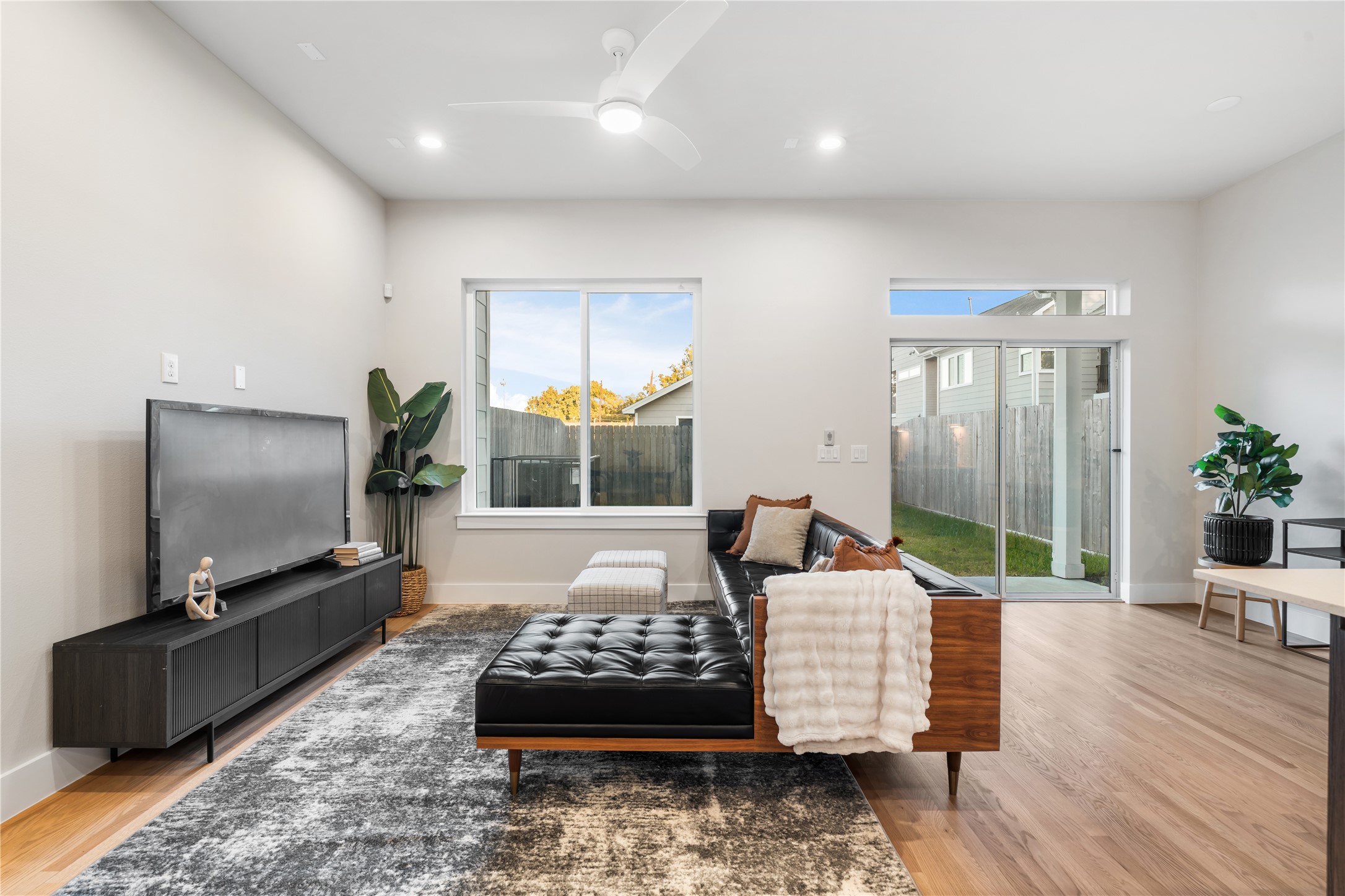1912 Erastus Street Houston, TX 77020 - Photo 11 of 29 The living room offers clear views of your covered patio and expansive backyard, seamlessly blending indoor comfort with outdoor living.