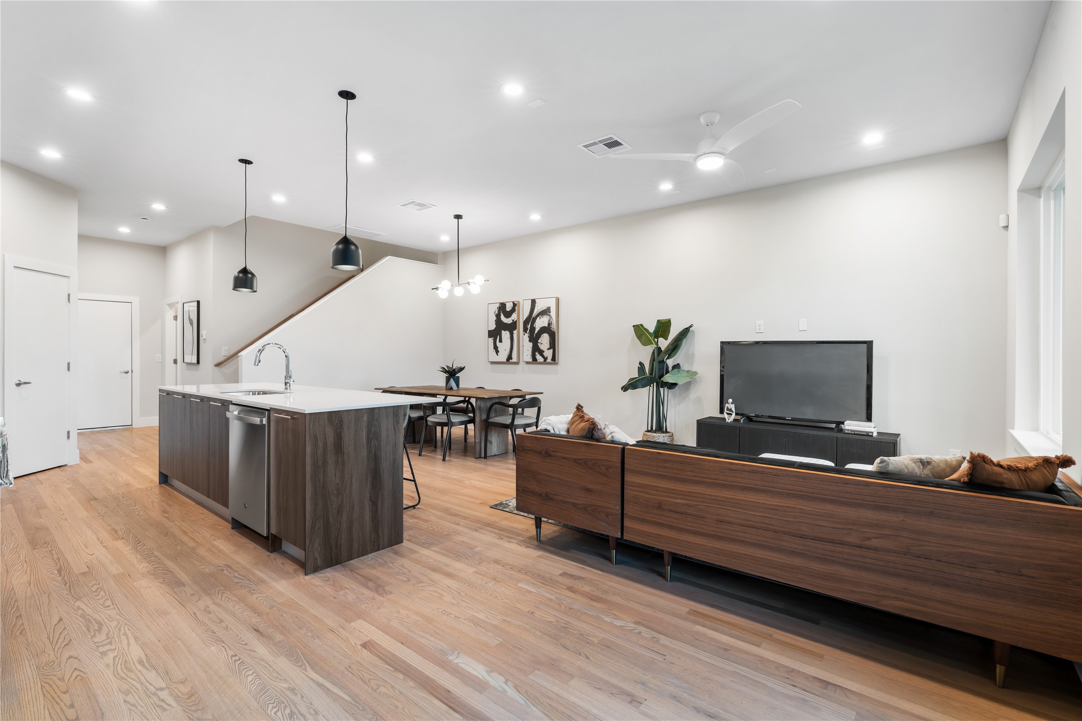 1912 Erastus Street Houston, TX 77020 - Photo 13 of 29 A view of the main living area from the covered patio highlights the home’s seamless indoor-outdoor connection, perfect for entertaining or quiet evenings in.