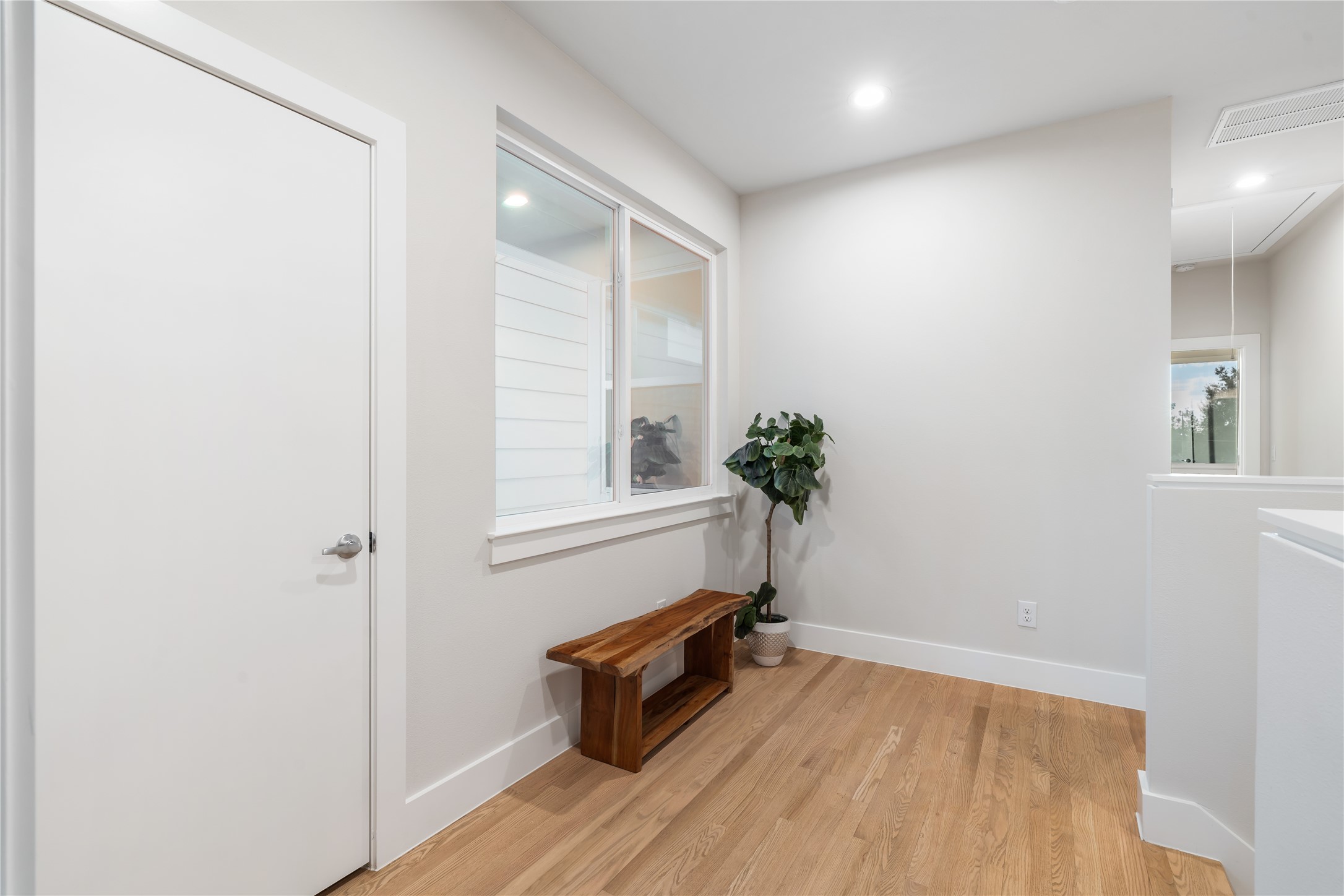 1912 Erastus Street Houston, TX 77020 - Photo 15 of 29 Upstairs, all bedrooms are positioned for comfort and privacy, featuring real hardwood floors throughout, no carpet in sight.