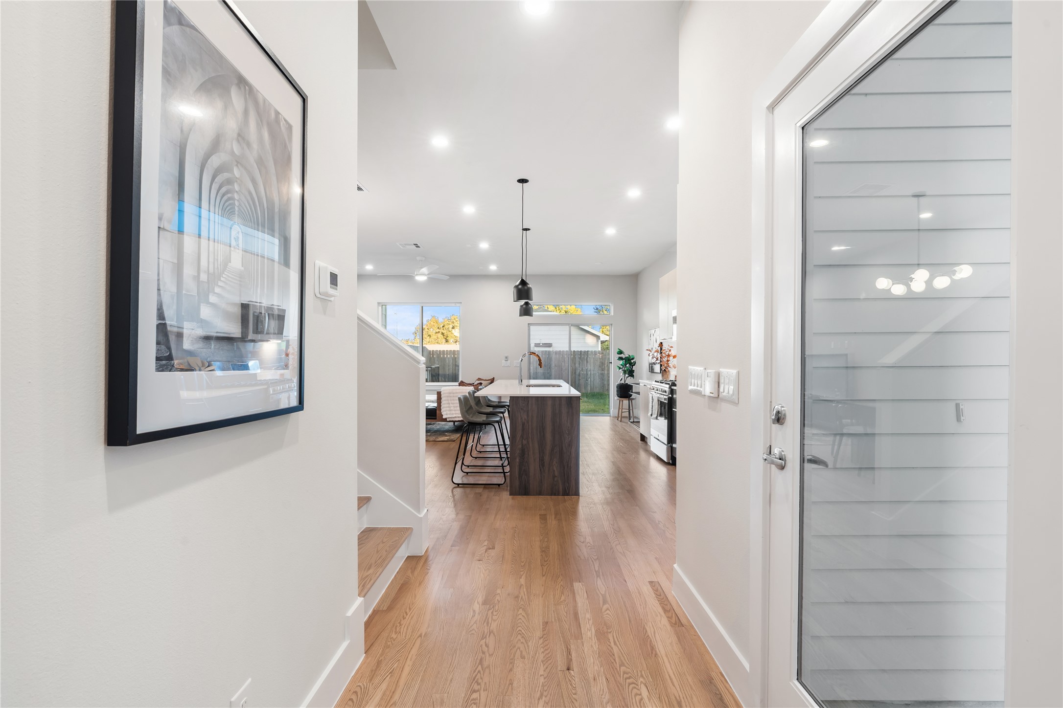 1912 Erastus Street Houston, TX 77020 - Photo 29 of 29 As you enter, you’re greeted by the warm, natural tones of real hardwood floors that lead into an open, inviting floor plan. Enjoy the ease of first-floor living, where everyday moments like bringing in groceries, feel effortless.