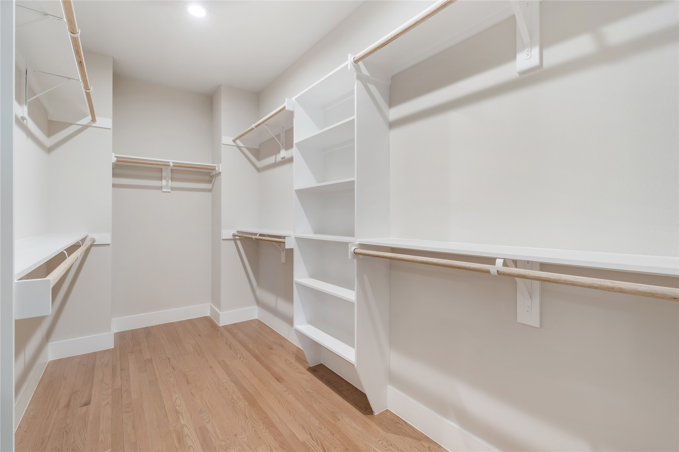 1912 Erastus Street Houston, TX 77020 - Photo 21 of 29 The spacious primary walk-in closet offers abundant hanging space and built-in shelving.