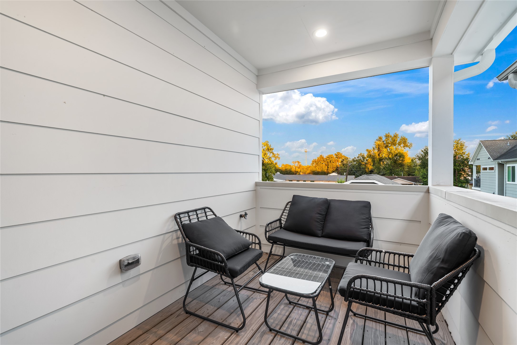 1912 Erastus Street Houston, TX 77020 - Photo 22 of 29 Step out onto your private covered balcony, a peaceful retreat just off the primary bedroom, perfect for enjoying your morning coffee or winding down in the evening.