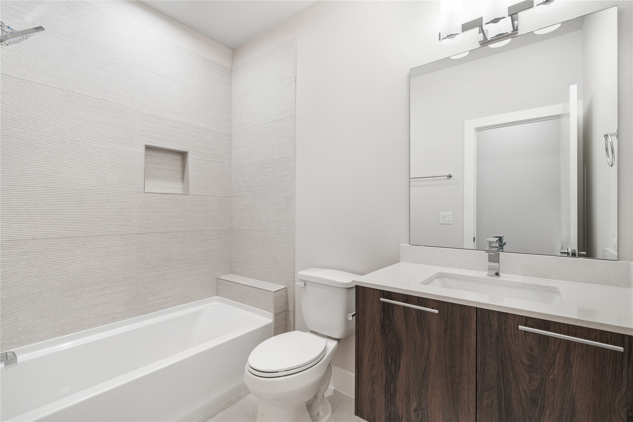 1912 Erastus Street Houston, TX 77020 - Photo 24 of 29 A full bathroom conveniently located on the second floor, featuring a floating vanity with quartz countertops and modern finishes your guests will appreciate.