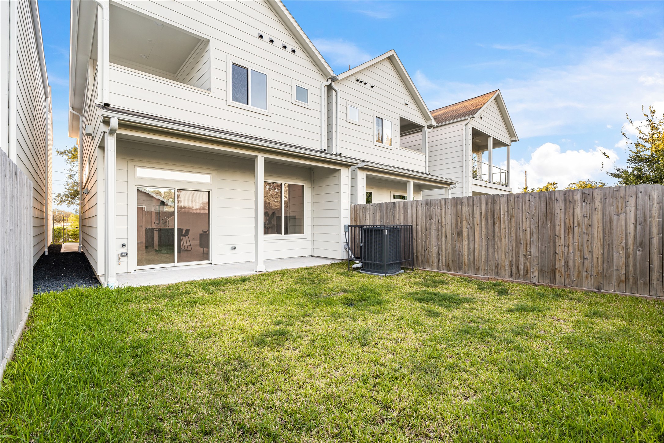1912 Erastus Street Houston, TX 77020 - Photo 28 of 29 A view of your spacious backyard, complete with full gutters and French drains, offering both functionality and peace of mind for years to come.