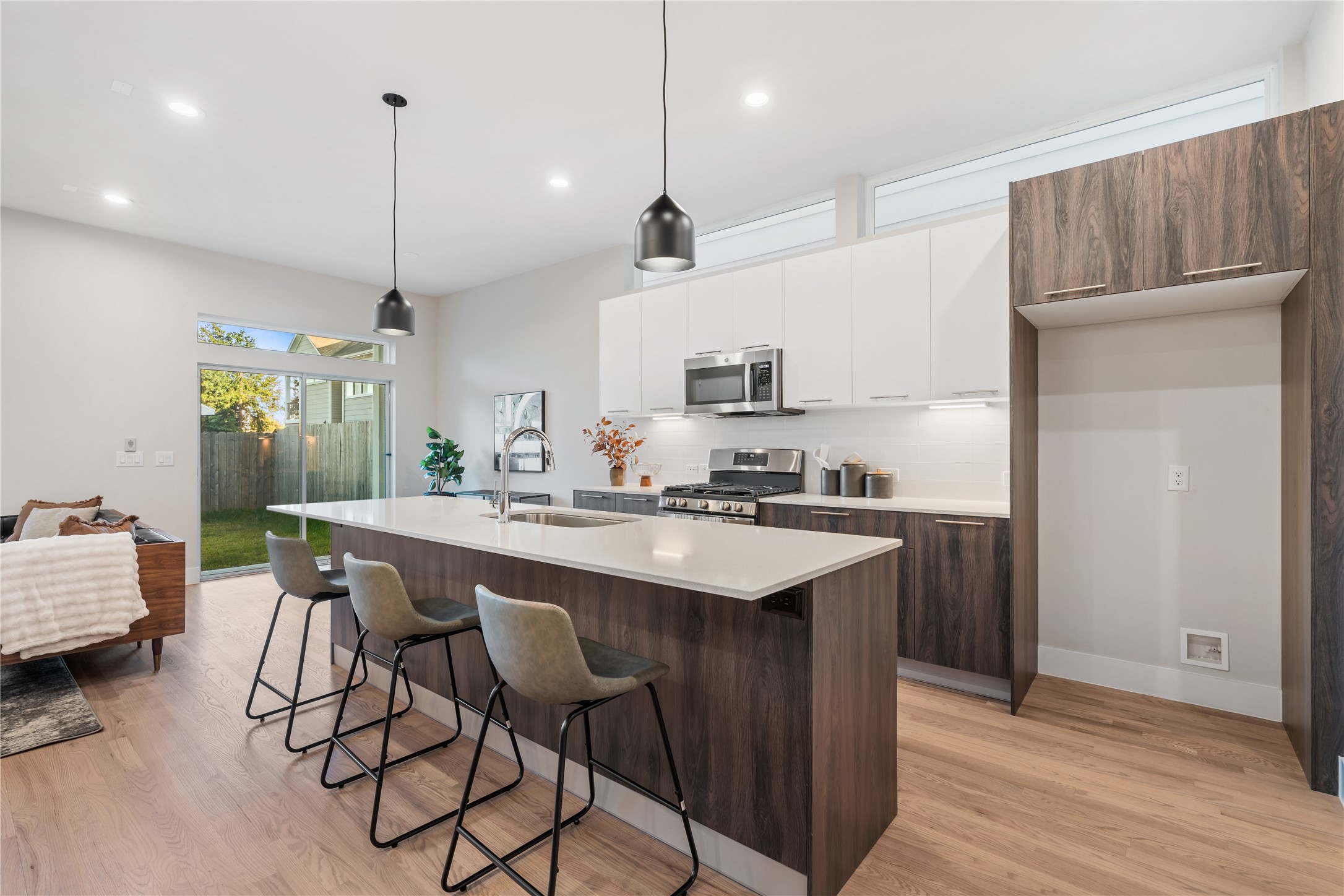 1912 Erastus Street Houston, TX 77020 - Photo 2 of 29 A stunning kitchen designed for both beauty & function, featuring an oversized island, two-tone European-style cabinetry & stainless steel appliances. From meal prep to dinner parties, this is where every gathering feels elevated.