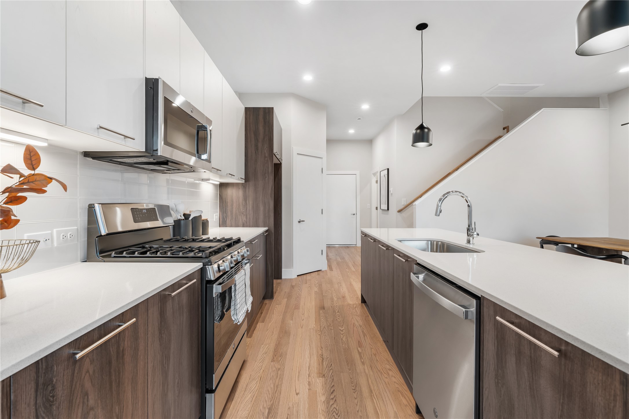 1912 Erastus Street Houston, TX 77020 - Photo 5 of 29 quipped with stainless steel appliances, a spacious walk-in pantry & soft-close drawers, this kitchen blends everyday convenience with sleek, modern design.