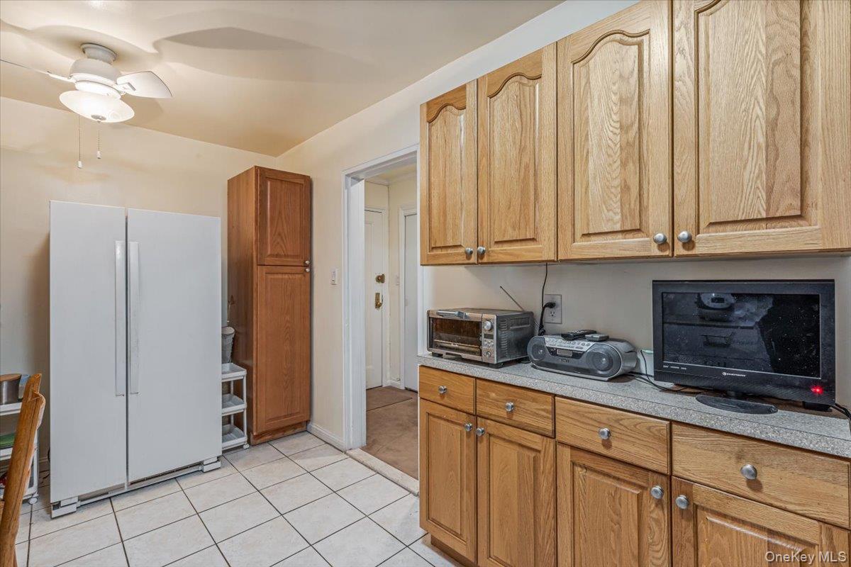 144-60 Gravett Road, Unit 6F Queens, NY 11367 - Photo 12 of 20 a kitchen with stainless steel appliances granite countertop a sink a stove and a refrigerator