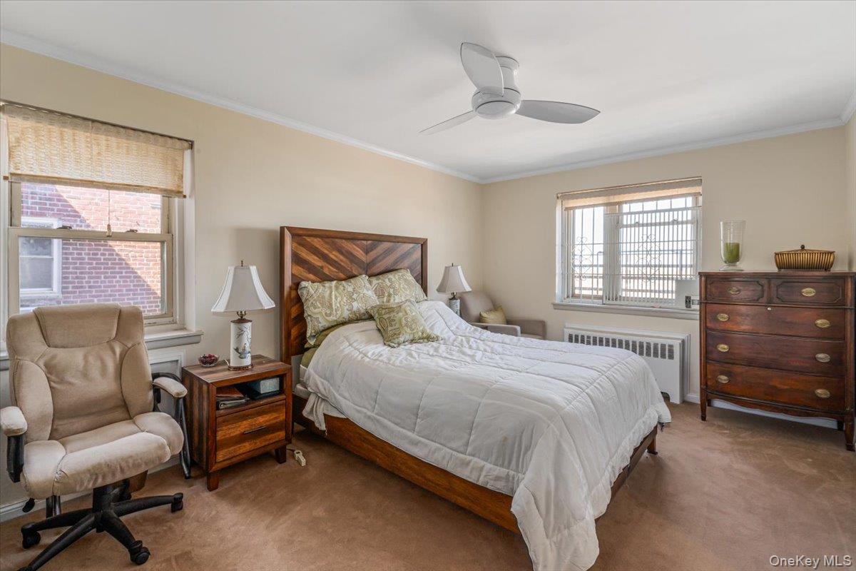 144-60 Gravett Road, Unit 6F Queens, NY 11367 - Photo 13 of 20 a bedroom with a bed and a couch