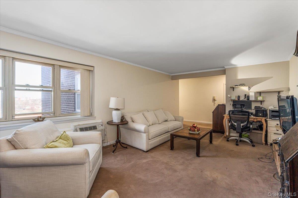 144-60 Gravett Road, Unit 6F Queens, NY 11367 - Photo 4 of 20 a living room with furniture and a large window