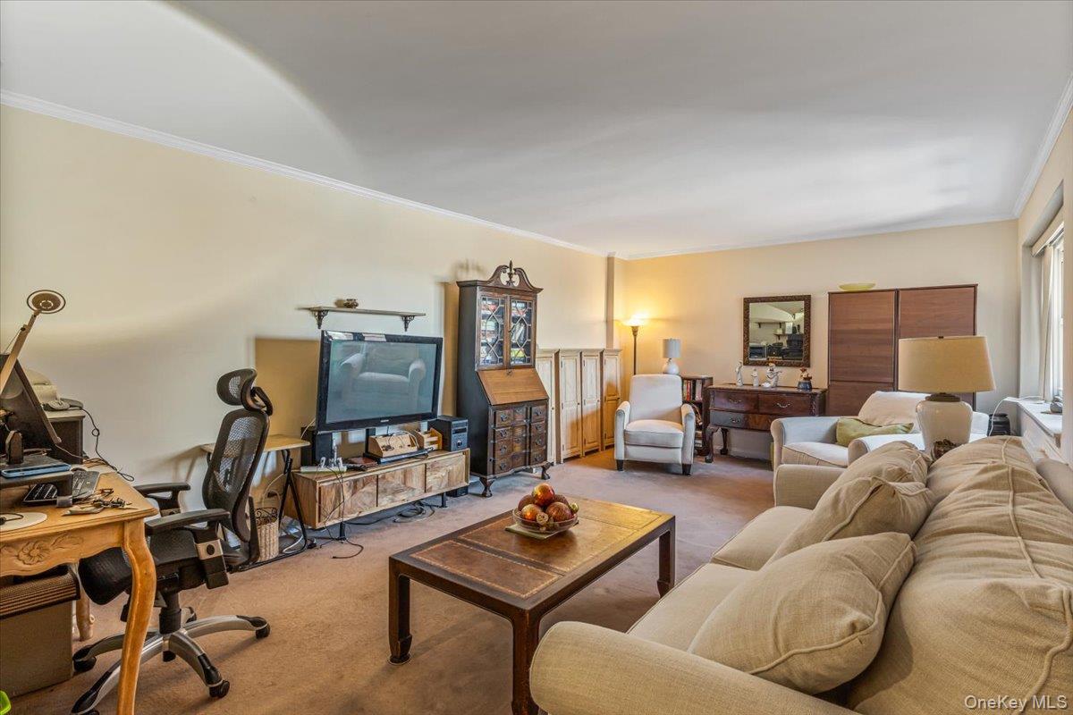 144-60 Gravett Road, Unit 6F Queens, NY 11367 - Photo 5 of 20 a living room with furniture and a flat screen tv