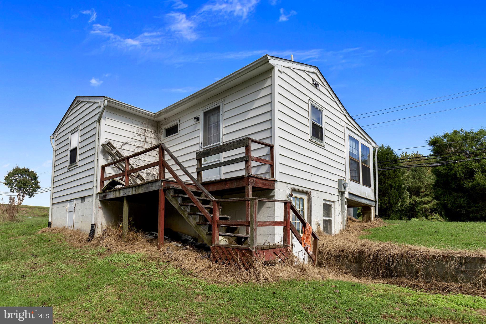 2730 Solomons Island Road Huntingtown, MD 20639 - Photo 11 of 22 a view of a house with a yard