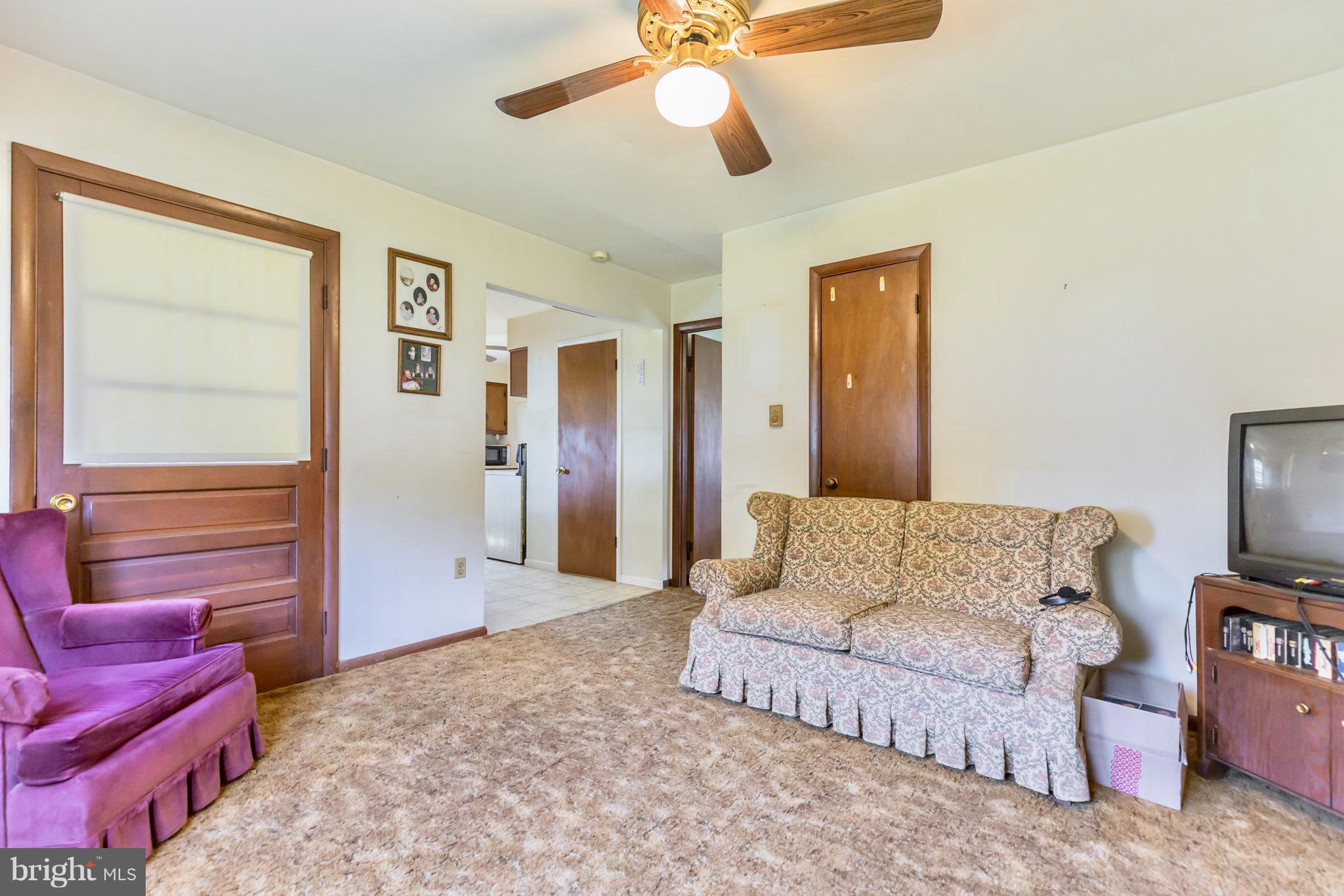 2730 Solomons Island Road Huntingtown, MD 20639 - Photo 13 of 22 a living room with furniture and a flat screen tv