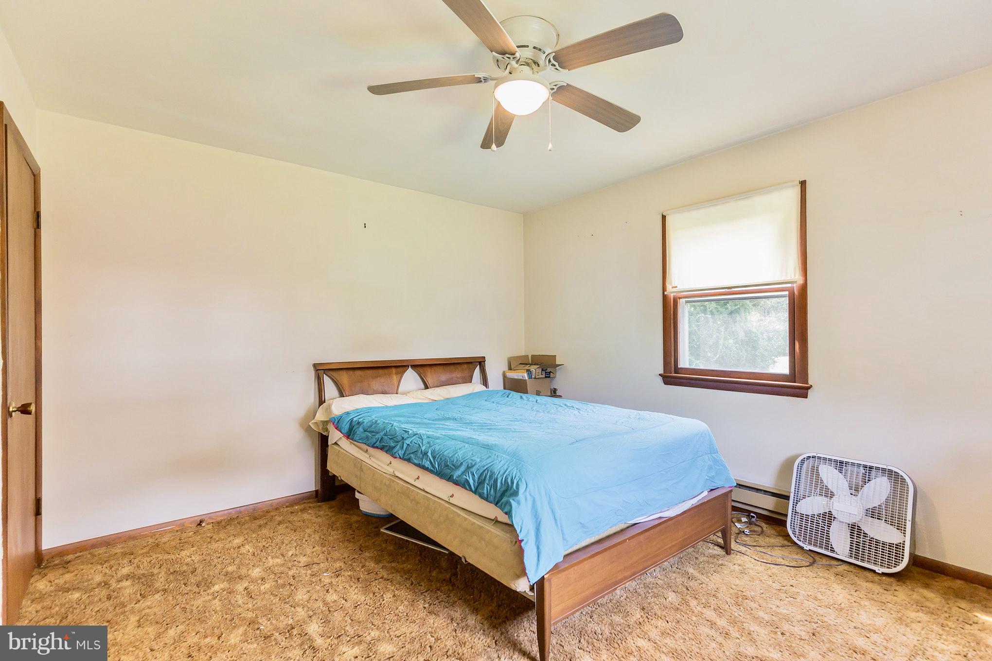 2730 Solomons Island Road Huntingtown, MD 20639 - Photo 15 of 22 a bedroom with a bed and a window
