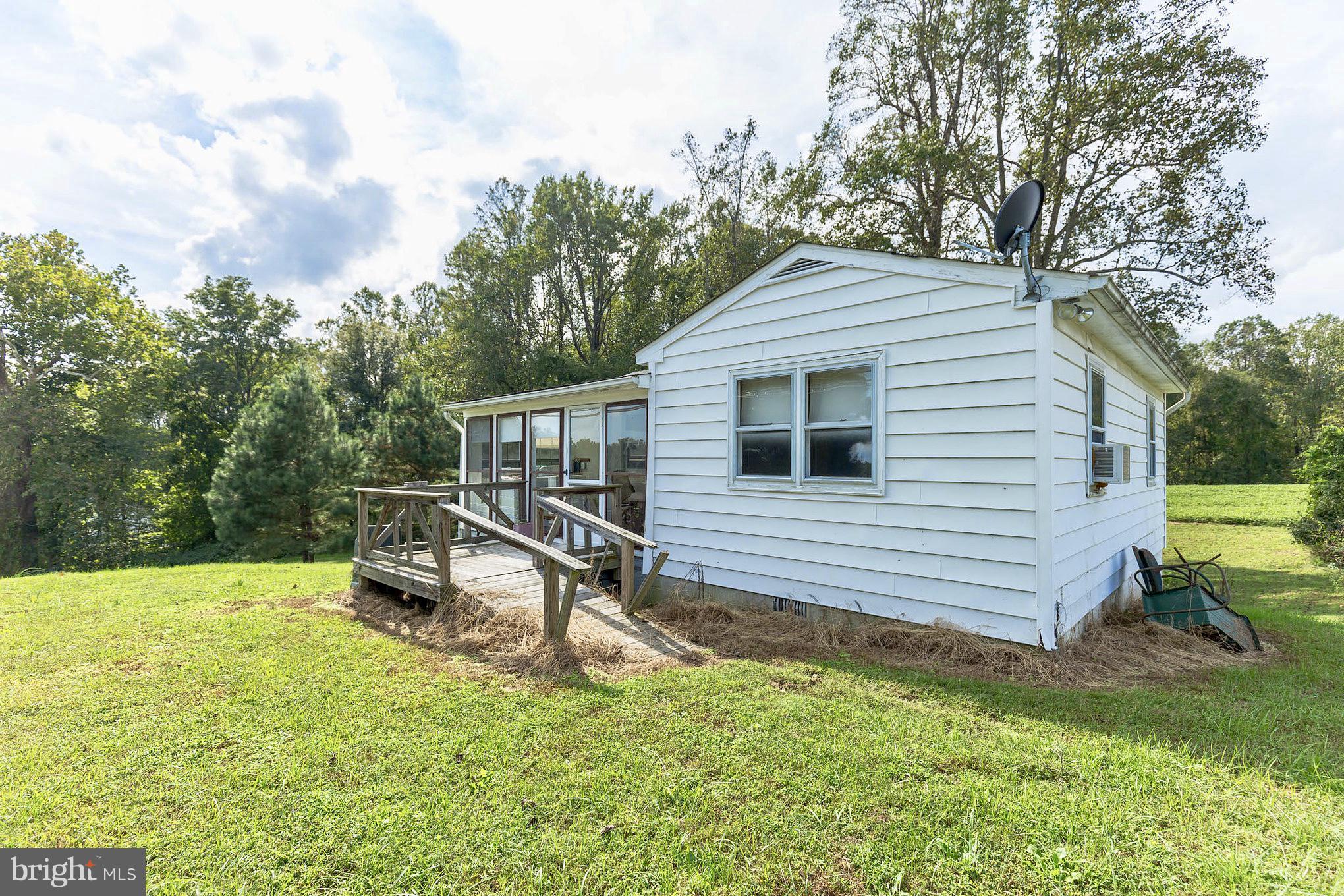 2730 Solomons Island Road Huntingtown, MD 20639 - Photo 20 of 22 a view of a house with a yard