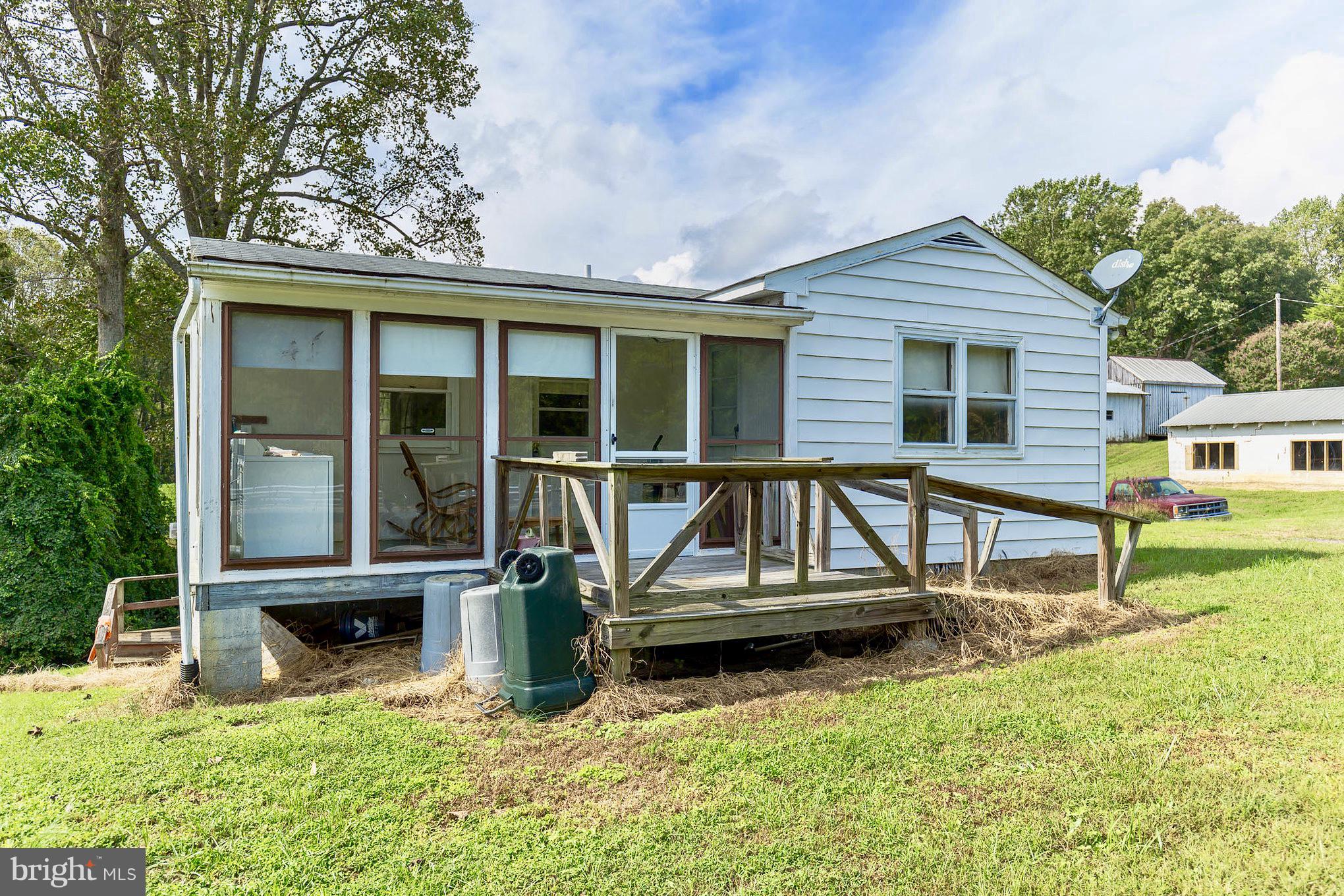 2730 Solomons Island Road Huntingtown, MD 20639 - Photo 21 of 22 front view of a house with a yard