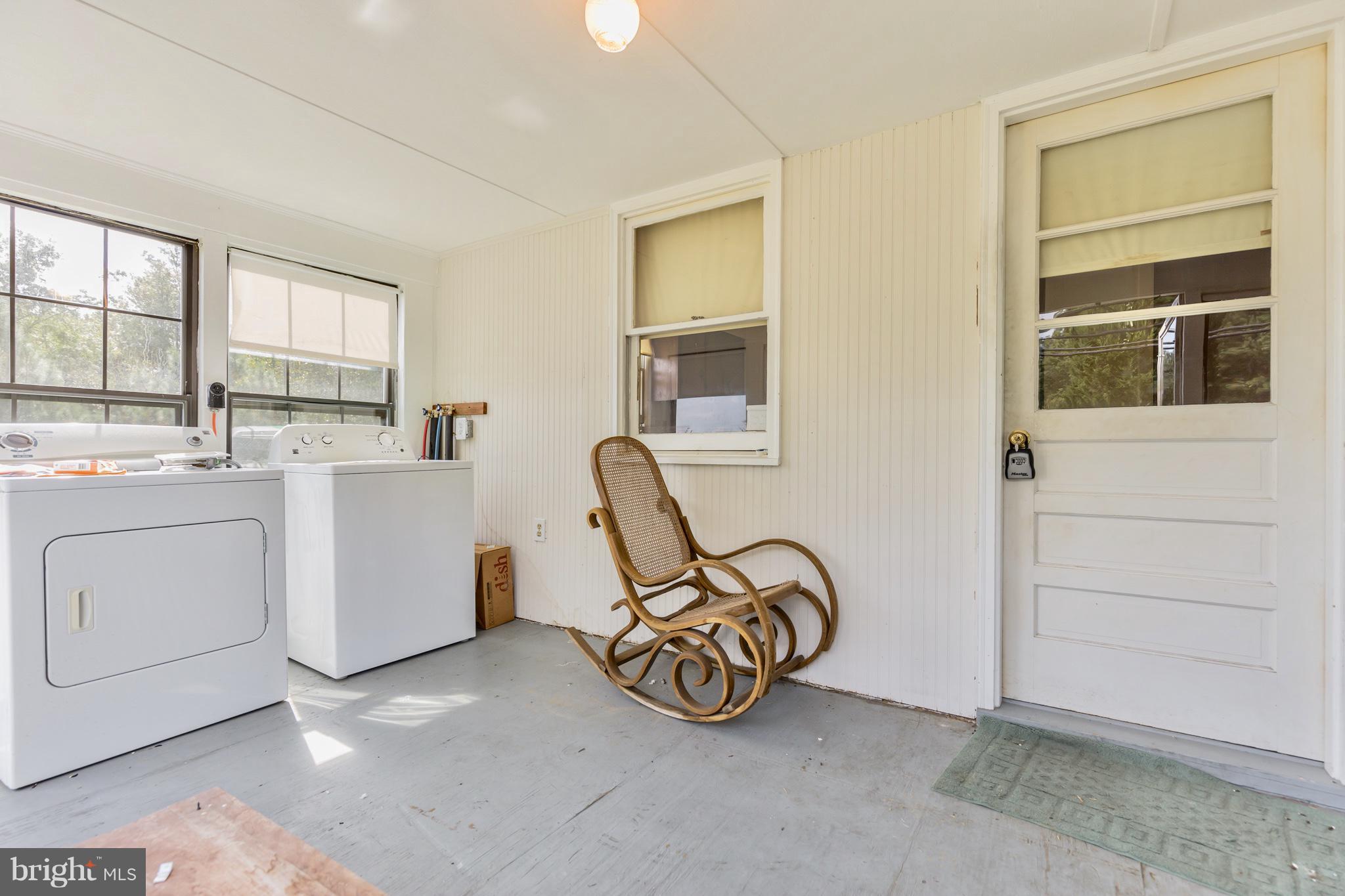 2730 Solomons Island Road Huntingtown, MD 20639 - Photo 6 of 22 a view of a storage & utility room with washer and dryer