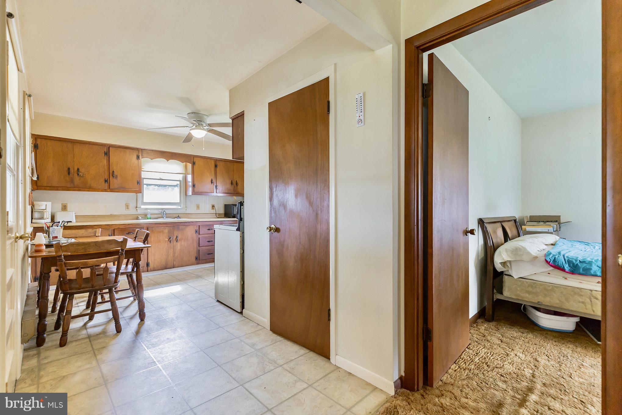 2730 Solomons Island Road Huntingtown, MD 20639 - Photo 7 of 22 a kitchen with a table and chairs