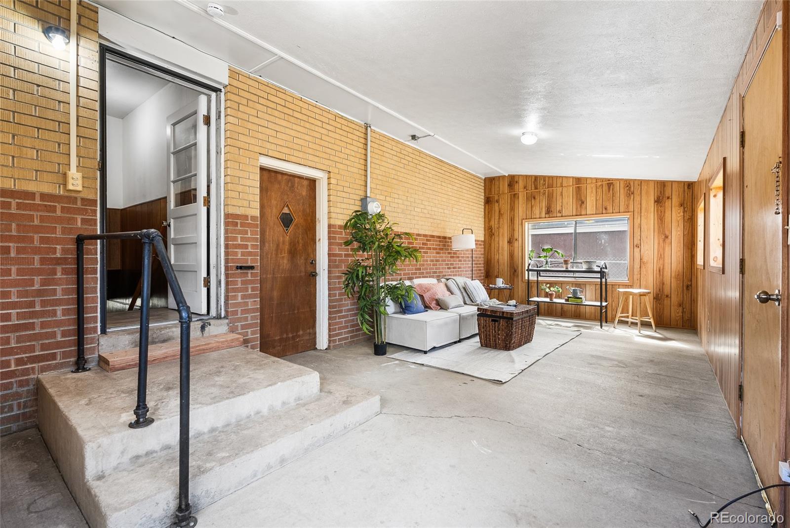 4585 Garland Street Wheat Ridge, CO 80033 - Photo 20 of 35 a bedroom with furniture and large window
