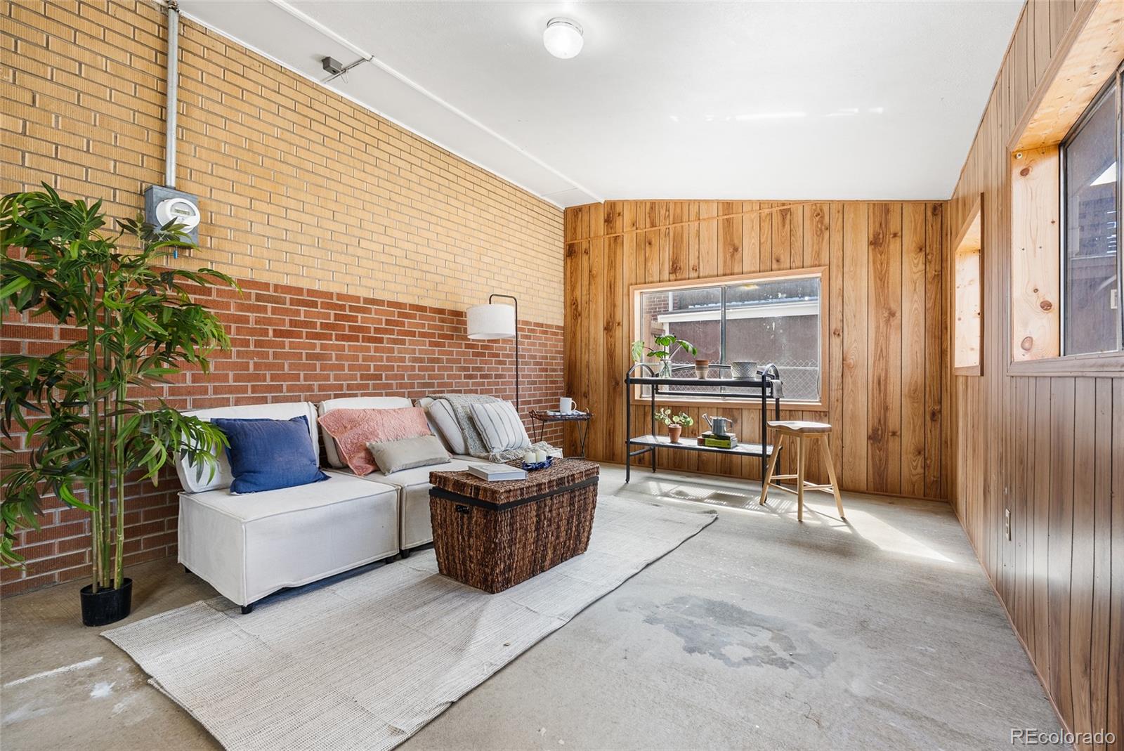 4585 Garland Street Wheat Ridge, CO 80033 - Photo 21 of 35 a living room with furniture and a large window