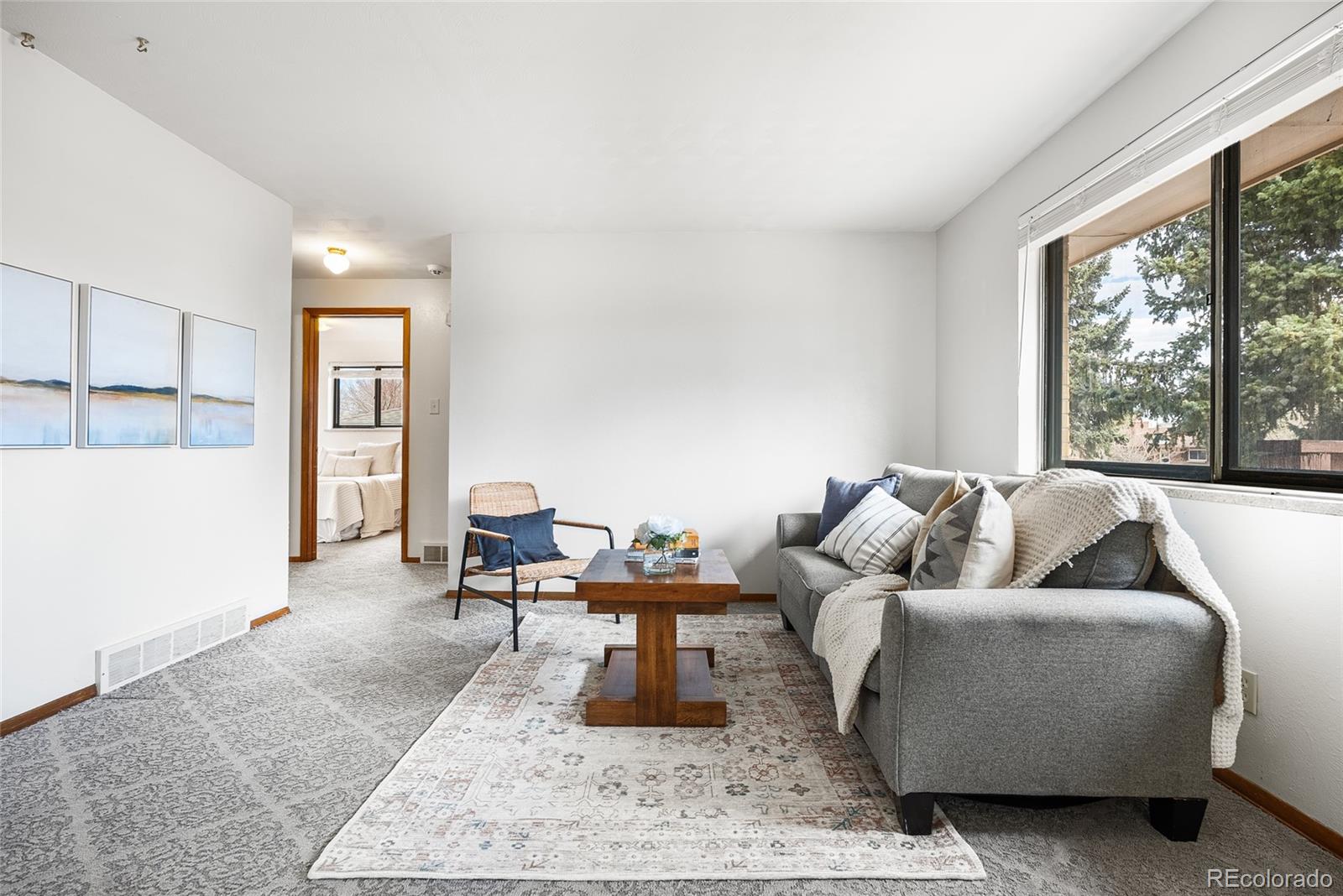 4585 Garland Street Wheat Ridge, CO 80033 - Photo 4 of 35 a living room with furniture and a large window