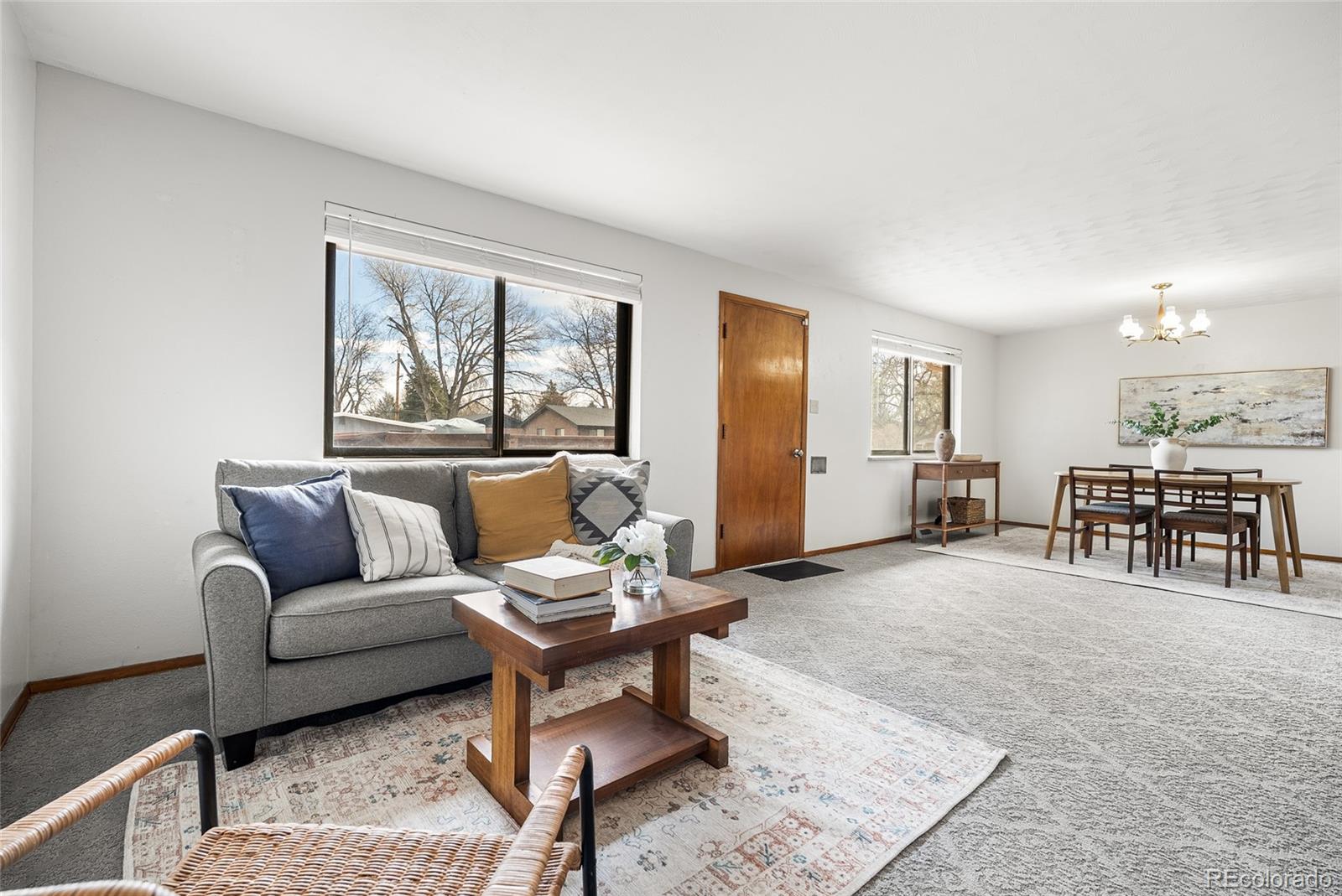 4585 Garland Street Wheat Ridge, CO 80033 - Photo 5 of 35 a living room with furniture and a large window