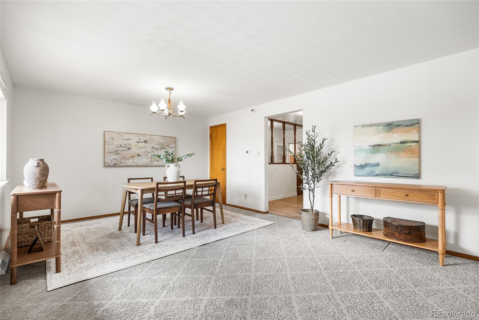 4585 Garland Street Wheat Ridge, CO 80033 - Photo 7 of 35 a view of a livingroom with furniture and a fireplace