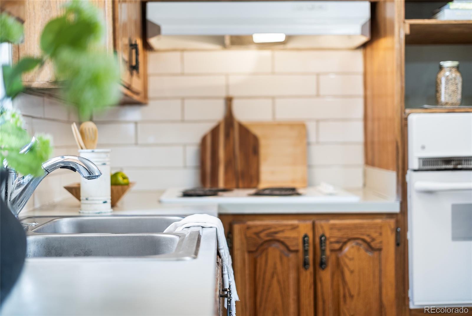 4585 Garland Street Wheat Ridge, CO 80033 - Photo 10 of 35 a bathroom with a sink and a mirror