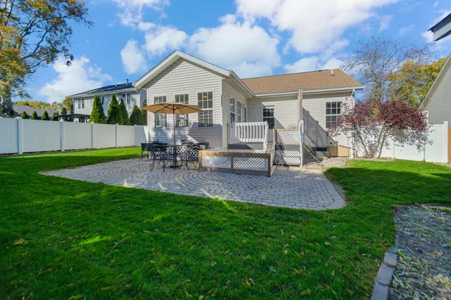 a view of a house with a yard porch and sitting area